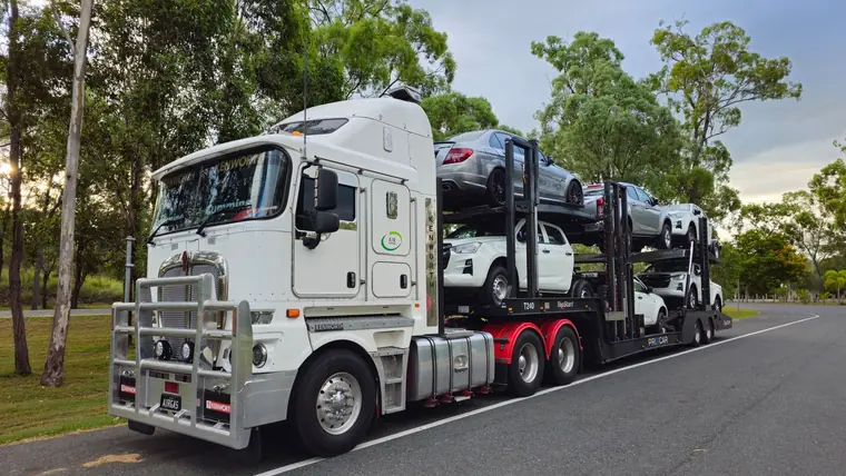 A car carrier truck loaded with vehicles on a road